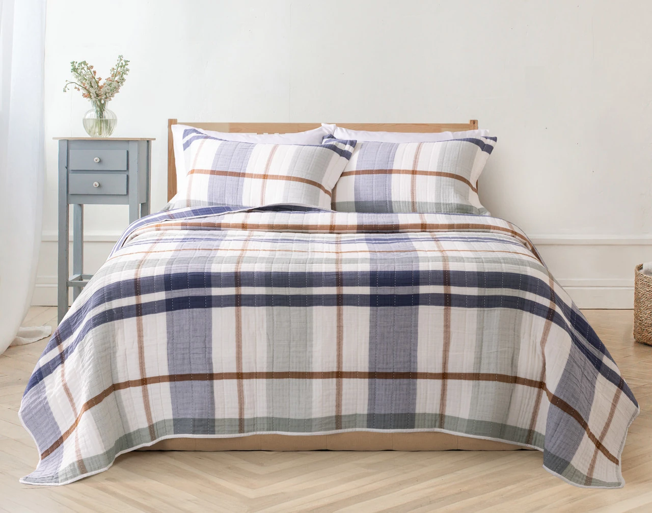Front view of our Finn Quilt Set dressing a queen bed in a modern bedroom.