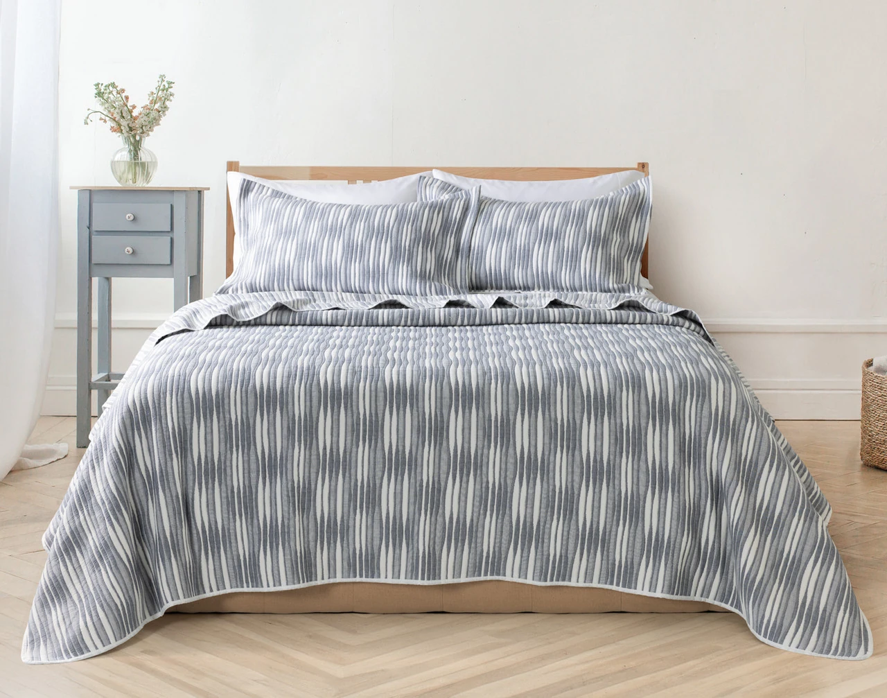 Front view of our Tidemark Quilt Set dressed over an empty queen bed.