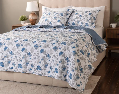 Angled view of our Blaire Coverlet Set dressed over a plain queen bed.