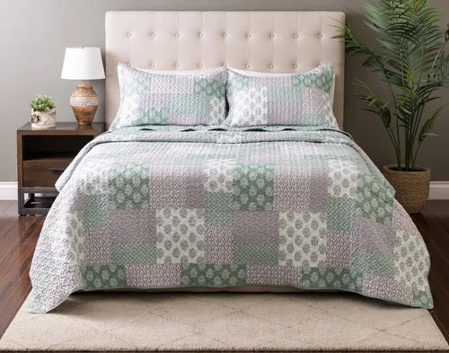 Front view of our Nora Coverlet Set dressed over a plain queen bed.