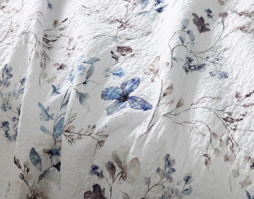 Close-up of the floral surface of our Alma Cotton Quilt Set.