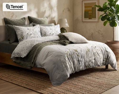 Angled view of our Greydon Duvet Cover dressed with accessories.