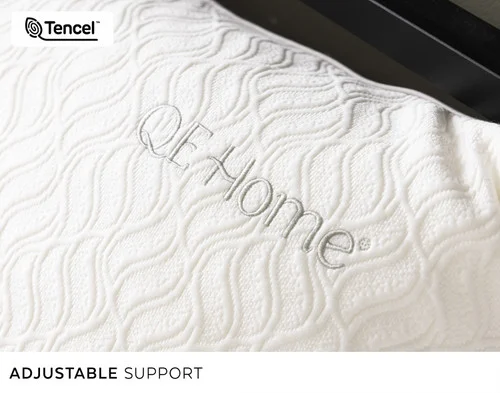Close up on the QE Home embroidery of our Deep Sleep Shredded Memory Foam & Lyocell Pillow.