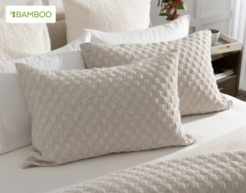 Our Cavendish Pillow Shams dressing the head of a bed.