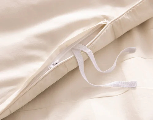 Close up on the inside ties of our Obrigado Duvet Cover.