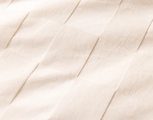 Close up on the surface of our Obrigado Duvet Cover.