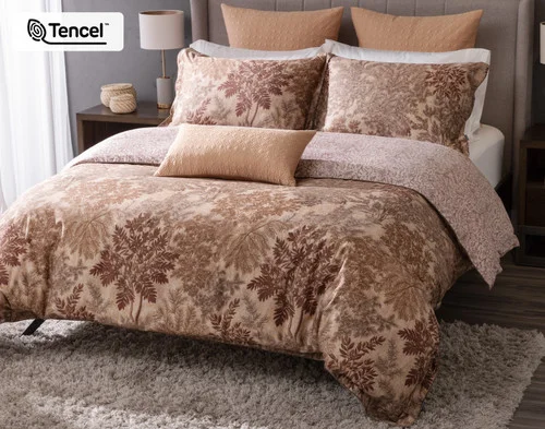 Angled view of our Henna Leaf Duvet Cover dressing a queen bed in a simple bedroom.