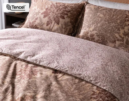 Angled view of our Henna Leaf Duvet Cover dressing the head of a queen bed.