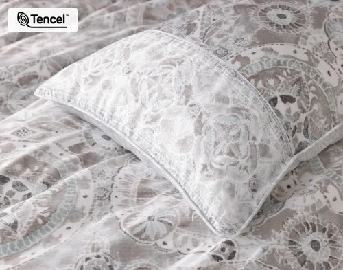 Our Romano Pillow Sham atop our Romano Duvet Cover.