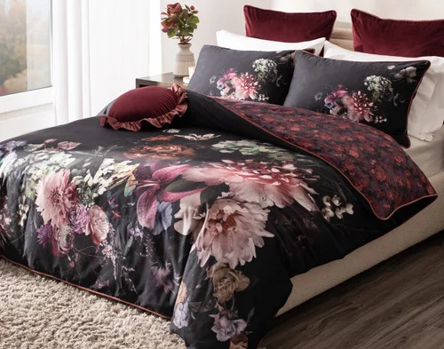 Angled view of our Valentina Duvet Cover dressing a queen bed in a simple bedroom.