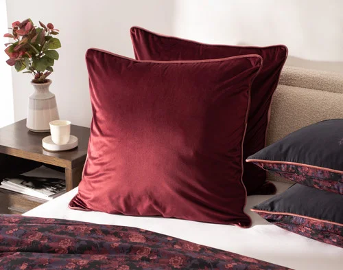 Our Valentina Euro Shams against the head of a bed.