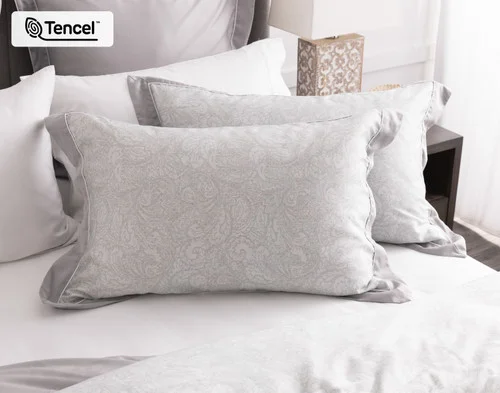 Our Sterling Pillow Shams dressing the head of a bed.
