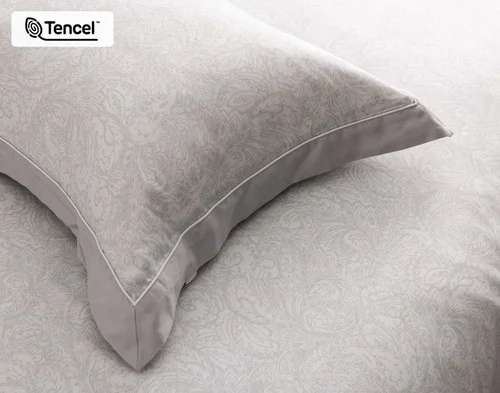 Close view of our Sterling Pillow Sham atop our Sterling Duvet Cover.