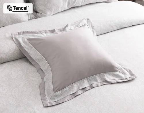Our Sterling Square Cushion laying on our Sterling collection at the head of a bed.