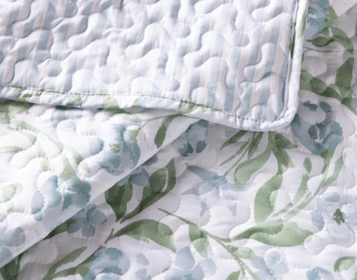 Close-up on a folded corner from our Pippa Coverlet Set.