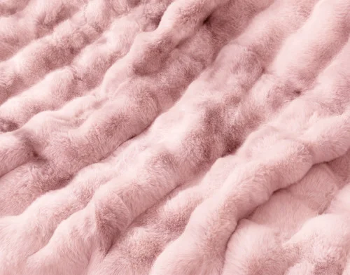 Close up on the surface of our Bubble Faux Fur Throw in Peony.