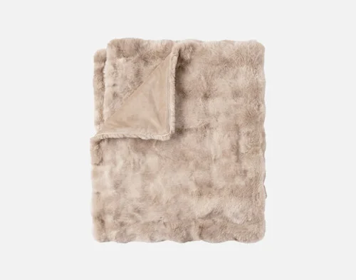 Our Bubble Faux Fur Throw in Champagne folded into a rectangle.