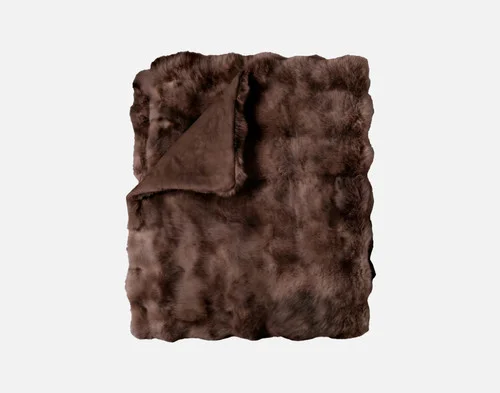 Our Bubble Faux Fur Throw in Truffle folded into a rectangle.