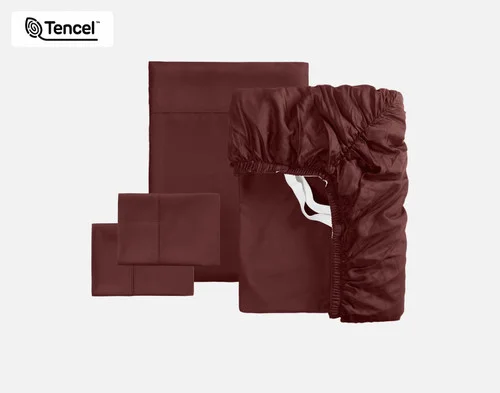 The full contents of our BeechBliss TENCEL™ Modal Sheet Set in Mahogany sitting against a solid background, including a fitted sheet, flat sheet, and two pillowcases.