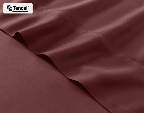 Close-up on the fitted and flat sheet of our BeechBliss TENCEL™ Modal Sheet Set in Mahogany.