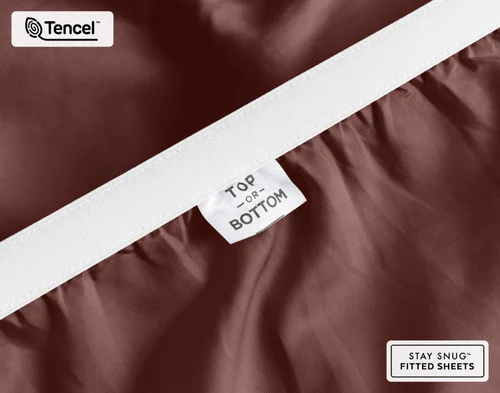 Close-up of Top & Bottom tag on the elastic of our BeechBliss TENCEL™ Modal Fitted Sheet in Mahogany.