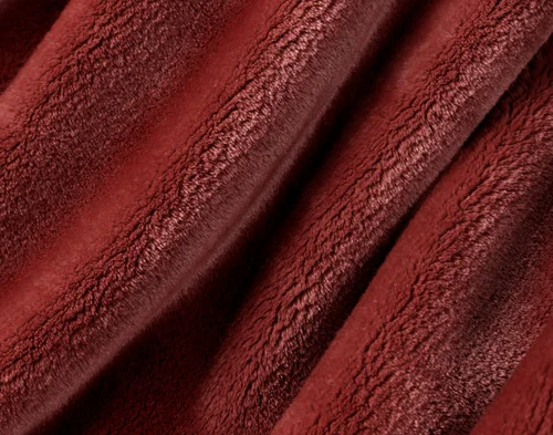 Close-up on our Velvet Plush Throw in Redwood to show its soft velveteen texture.