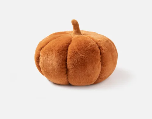 Side view of our Pumpkin Cushion in Copper sitting against a solid white background.