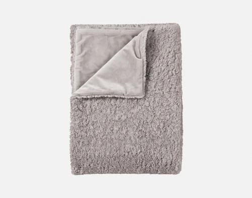 Our Ashwood Poodle Faux Fur Throw neatly folded.
