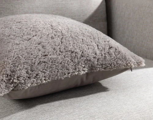 Close-up of the corners and edge on our Ashwood Poodle Faux Fur Square Cushion.