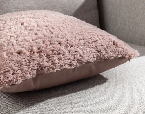Close-up of the corners and edge on our Dusty Rose Poodle Faux Fur Square Cushion.