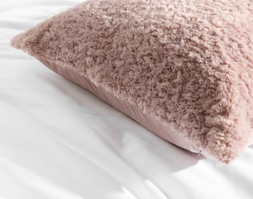 Close-up of the corners and edge on our Dusty Rose Poodle Faux Fur Euro Sham.