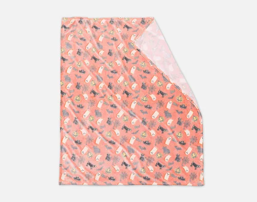Folded view of our Boo & Bones Glow in the Dark Fleece Throw on a white ground.