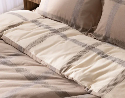 Angled view of our Bowen Duvet Cover Set dressing the head of a bed.