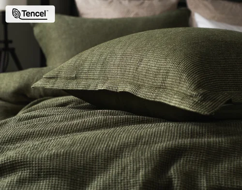 Our Greenwood Pillow Sham resting atop our Greenwood Duvet Cover.