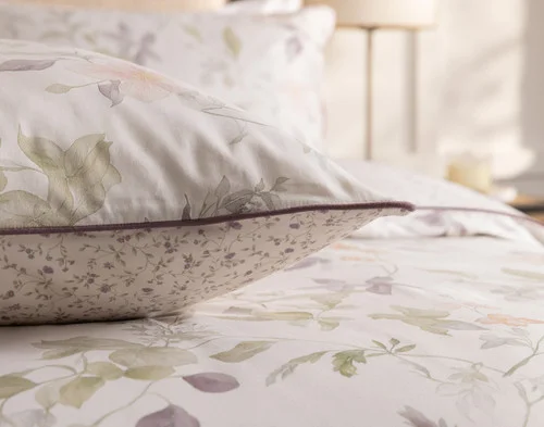 Our Elodie Pillow Sham resting atop our Elodie Duvet Cover.