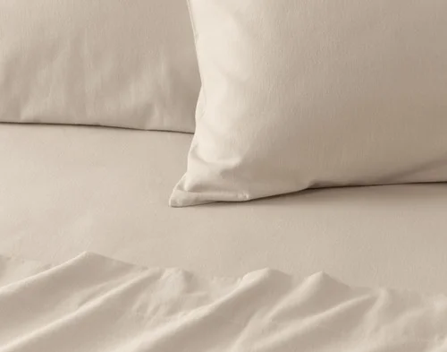 Close-up on the corner of a pillowcase from our Toasted Oat Flannel Sheet Set.