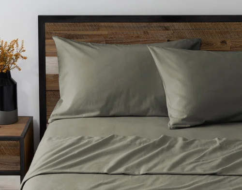 Front view of two pillowcases from our Alpine Forest Flannel Sheet Set leaning against a headboard.