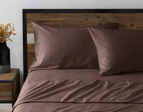 Front view of two pillowcases from our Rustic Woods Flannel Sheet Set leaning against a headboard.