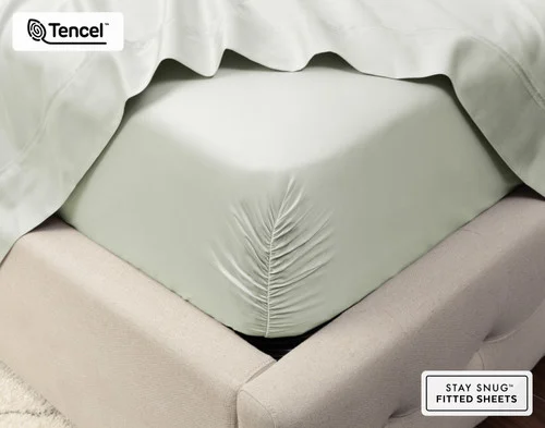 Close-up on the corner of our Eucalyptus Luxe Sheet Set in Oyster fit over a queen mattress.
