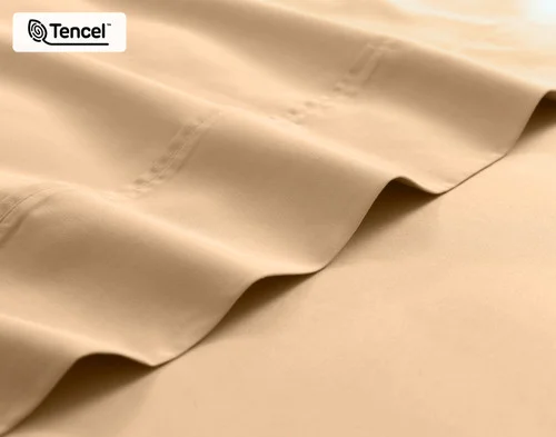 Close-up on the fitted and flat sheet of our Eucalyptus Luxe Sheet Set in Sandalwood.