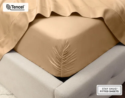 Close-up on the corner of a mattress with our Eucalyptus Luxe Fitted Sheet in Sandalwood to show its snug fit.
