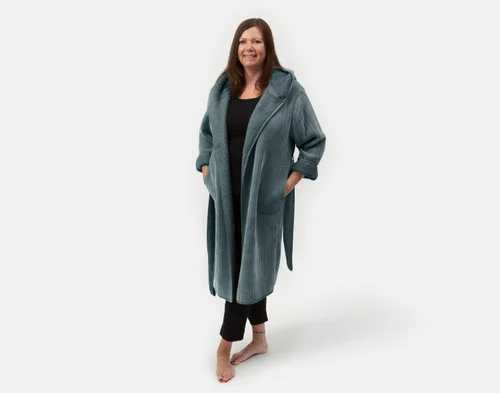 Front view of woman wearing our Chenille Sherpa Bathrobe in Juniper against a solid white background.