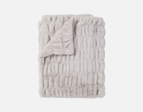 Our Cocoon Plush Throw in Silver folded into a rectangle against a white background.