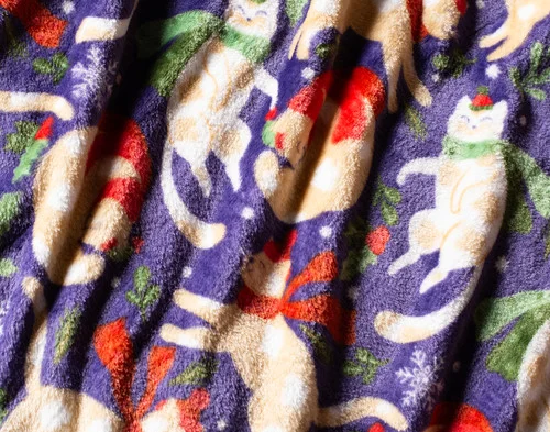 Close up on our Holiday Fleece Throw - Festive Felines.