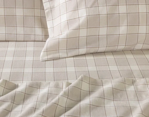Close-up of the pillowcases and flat sheet of our Cabin Check Organic Cotton Flannel Sheet Set.