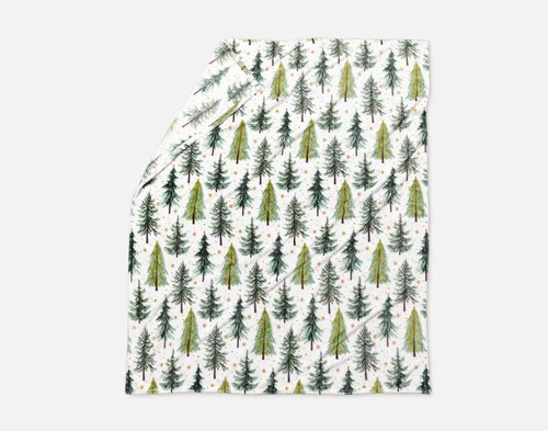Our Holiday Fleece Throw - Merry Pines lying with a fold against a white background.