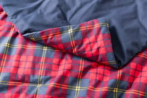 Close-up on the folded corner of our Bramble Ridge Cotton Flannel Comforter Set to show its smooth velvet backing.