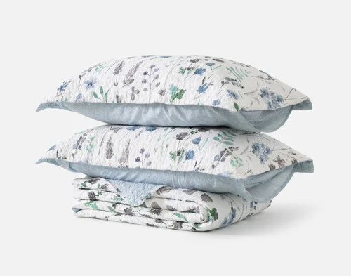 The contents of our Linnea Cotton Quilt Set resting in a neat stack.