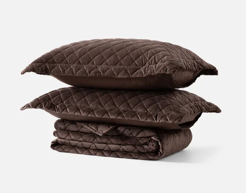 The contents of our Jasper Quilt Set folded against a white background.