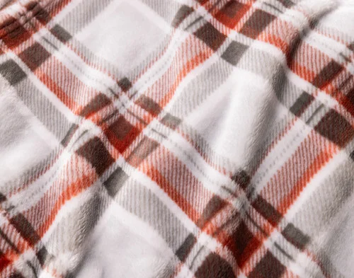 Close-up of the smooth cashmere surface of our Brome Plaid Blanket.